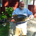 Bruce Kraemer landed a huge 9.98 pounds smallmouth bass from Michigan's Indian River on September 11, 2016.   Photo Credit: Ron Krieg/Bruce Kraemer