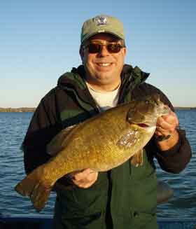 cameraguy boats a huge Mullett Lake smallmouth bass on a tube bait October 9 2008