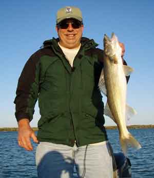cameraguy with a solid Mullett Lake walleye caught on a tube bait October 9 2008