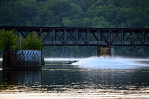 An Elite Series angler running under a bridge on Pickwick Lake practicing for the 2011 Alabama Charge