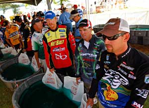 2011 Bassmaster Elite Series weigh in tent with tournament anglers waiting in line with their bass
