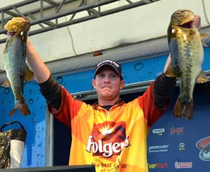 FLW Tour Pro winner Brandon McMillan holds up his two biggest bass from day four on Lake Okeechobee