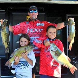 Brian Metry continues to lead the Bassmaster Northern Open after the day two weigh in on Lake St Clair shown here with his children and his big smallmouth bass