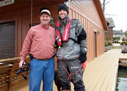 Alabama gentleman James Whitaker poses with Elite Series bass angler Aaron Martens after coming to the rescue with five gallons of gasoline on Lake Guntersville during the final practice day for the 2014 Bassmaster Classic