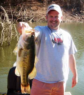 NBAA's National Director Jack Horning hoists up his 9 pound 2 ounce  Comedero prespawn bass