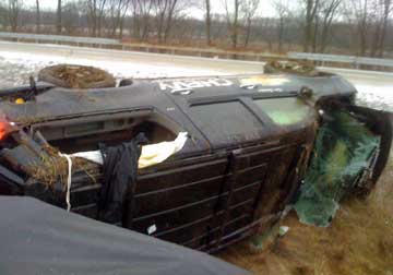 Kim Stricker's new Chevy Suburban lies on its side after a rollover accident on Interstate 70 near Effingham Illinois