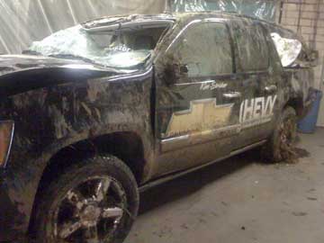 The aftermath of the rollover accident with Kim Stricker's Chevy Suburban.