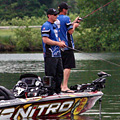 Detroit Lions Coach Jim Schwartz and Kevin VanDam fish Kent Lake during the 2013 KVD Charity Classic charity bass fishing tournament June 10th