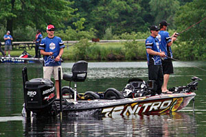 Detroit Lions Coach Jim Schwartz and Kevin VanDam fish Kent Lake along with one lucky sponsor drawing winner (back deck) during the 2013 KVD Charity Classic charity bass fishing tournament June 10th