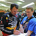 Michigan Bassmaster Elite Angler Kevin VanDam signs the Scientific Fish and Wildlife Conservation Act petition with GreatLakesBass.com owner Dan Kimmel