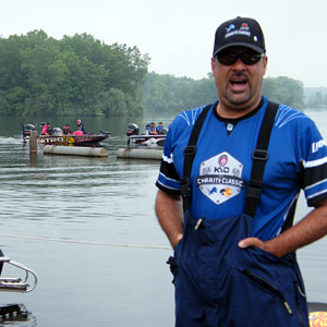 Mark Zona does a little all-in-good-fun trash-talking about ending up last boat out before the June 10th 2013 KVD Charity Classic tournament as KVD drives by in the background