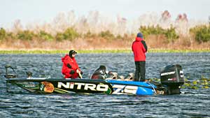 Elite angler Ott DeFoe, shown landing a Florida bass, leads the 2011 B.A.S.S. Rookie of the Year race after three Elite Series events