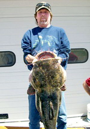 Rodney Akey with his record-setting catch 49.8 pounds flathead catfish from the St Joseph River in Michigan