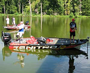 Bassmaster Kevin VanDam fishes with Sgt. 1st Class Jacque Keesler during the 2010 event