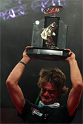Theo Corcoran gets emotional hoisting his 2013 Forrest Wood Cup championship trophy after his co-angler victory August 15-18 on Louisiana's Red River