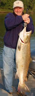 Tom Healy of Rockford Michigan holds a 41 pound 7 ounce new world record brown trout caught from the Manistee River September 9, 2009