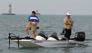 Captain Wayne Carpenter and Frank Keller fish a shallow Lake St. Clair flat.