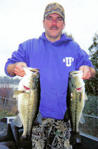 South Bend, IN angler Doug Roher poses with a 6# and 4# largemouth bass caught in early spring.