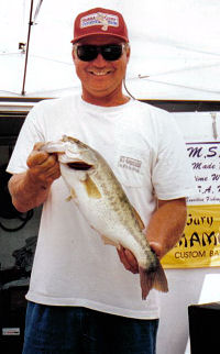 Elkhart, IN angler Kevin Fletcher poses with a 4.5# largemouth bass caught from the St. Joe River.