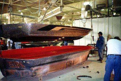When the hull is done curing, it's lifted from the mold and the results of a superior, correctly buffed mold are seen in a hull finish already show-room quality.