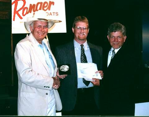 Easily the highlight of my 2001 fishing season, fishing in the Wal-Mart BFL All-American in Hot Spring Arkansas on Lake Hamilton. Here I’m receiving my award for 36th place and big bass from Forrest L. Wood and Dan Grimes at the post-tournament awards banquet.