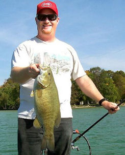 Me (Dan Kimmel) with a 6 3/4 pound Mullet Lake smallmouth bass that crushed my big painted spinnerbait.