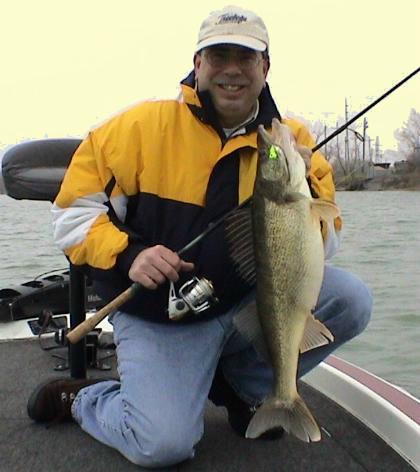 Mark Gomez shows off an 8 1/2 pound Detroit River walleye caught jigging the spring river runs.