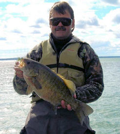 Paul Stokes with a 6 pound 2 ounce giant Northern Michigan smallmouth bass!