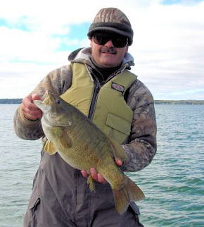 Paul Sacks with his 8 pound 2 ounce giant Northern Michigan smallmouth bass.